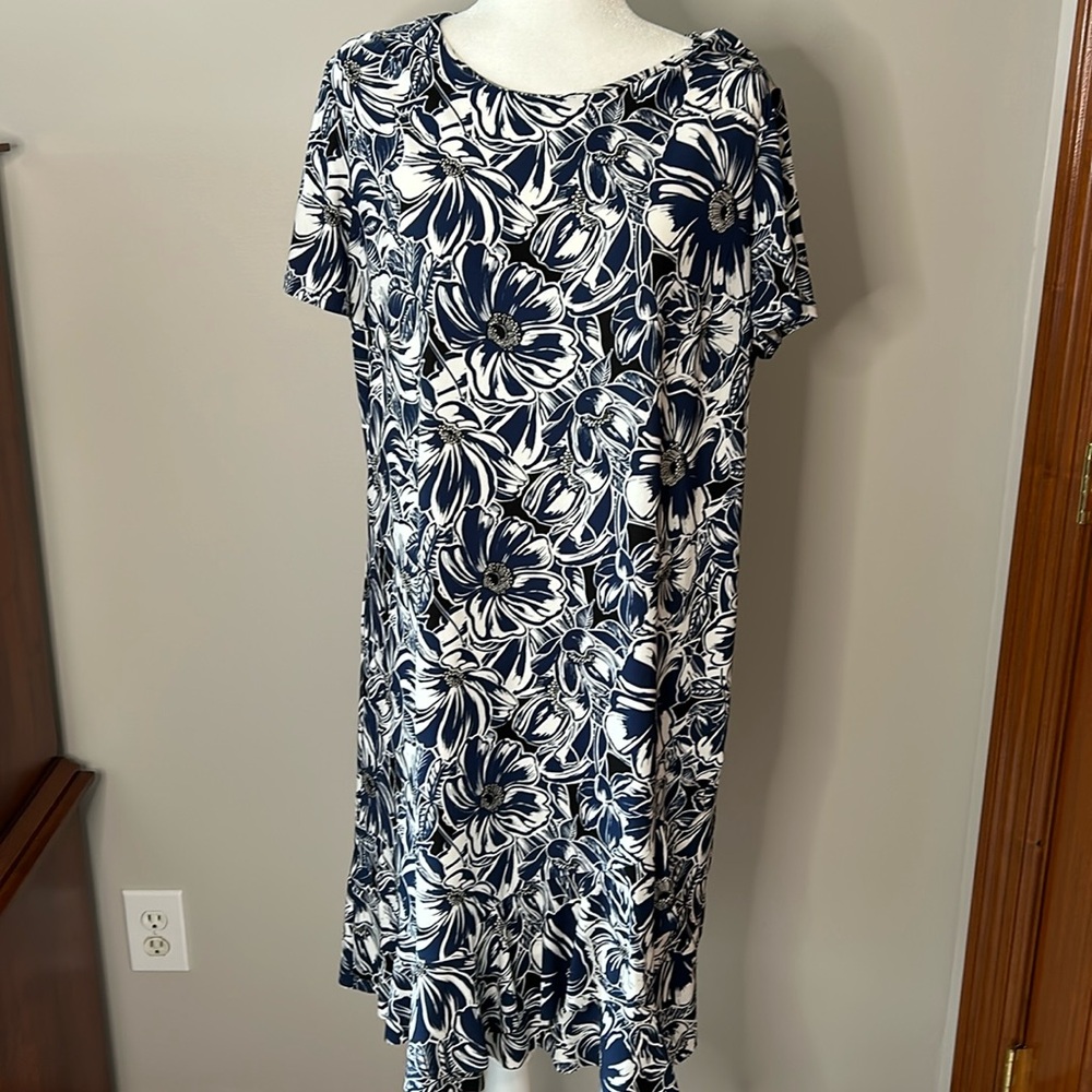 Blue and white round neck, cap sleeve dress with cute ruffle at bottom.